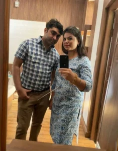 couple taking picture in front of the mirror scaled 1